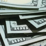 A pile of $100 bills